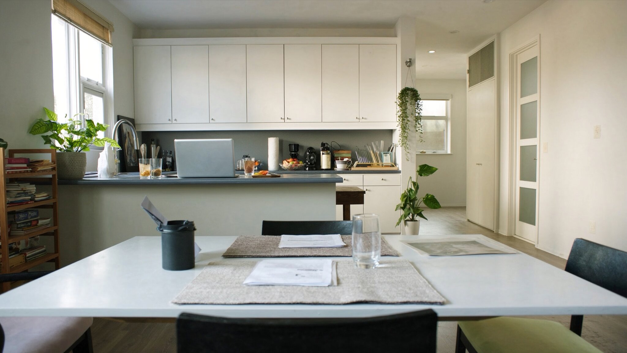 Couple reviewing condo purchase documents at kitchen table in Pacific Northwest home, King County WA
