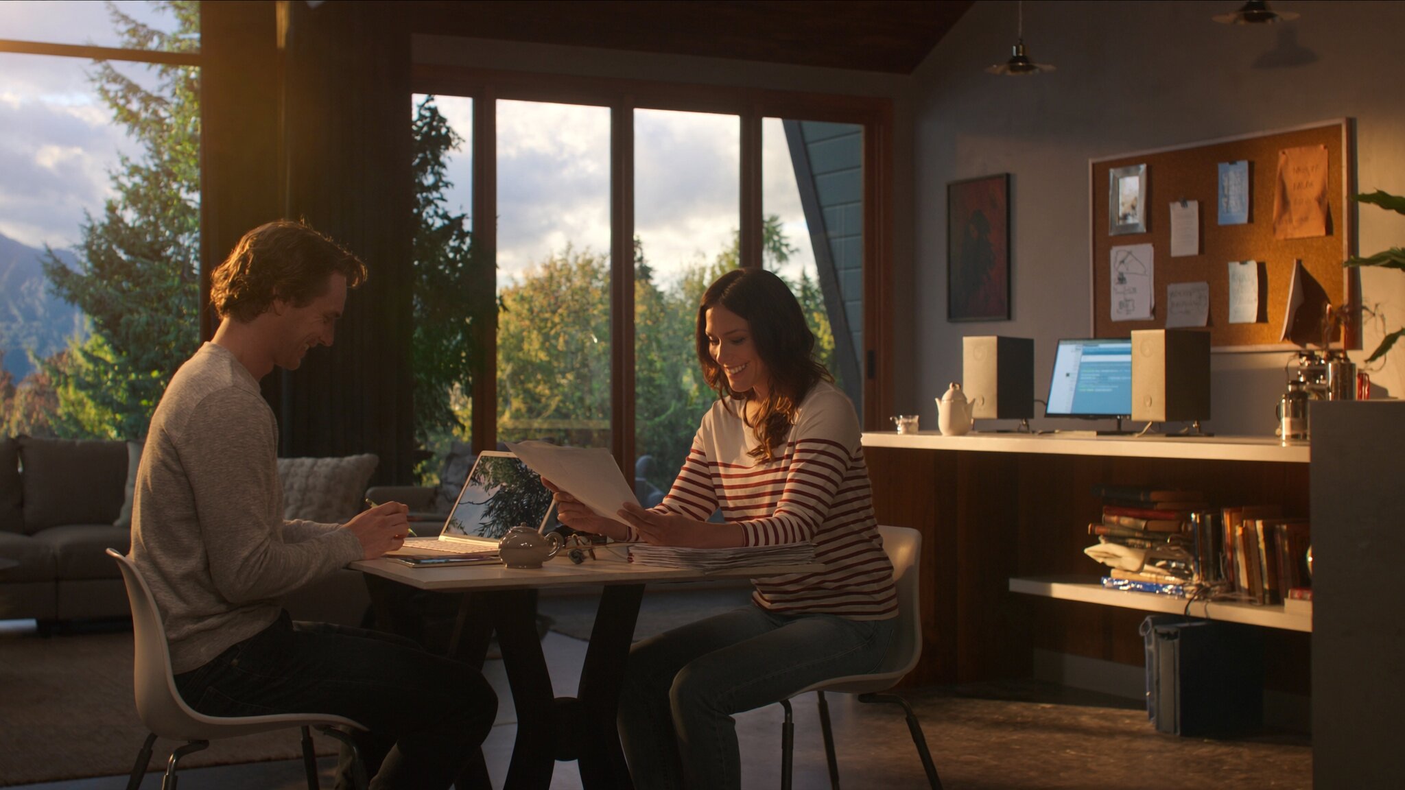 First-time homebuyer couple reviewing documents at home, Pacific Northwest setting, King County Washington