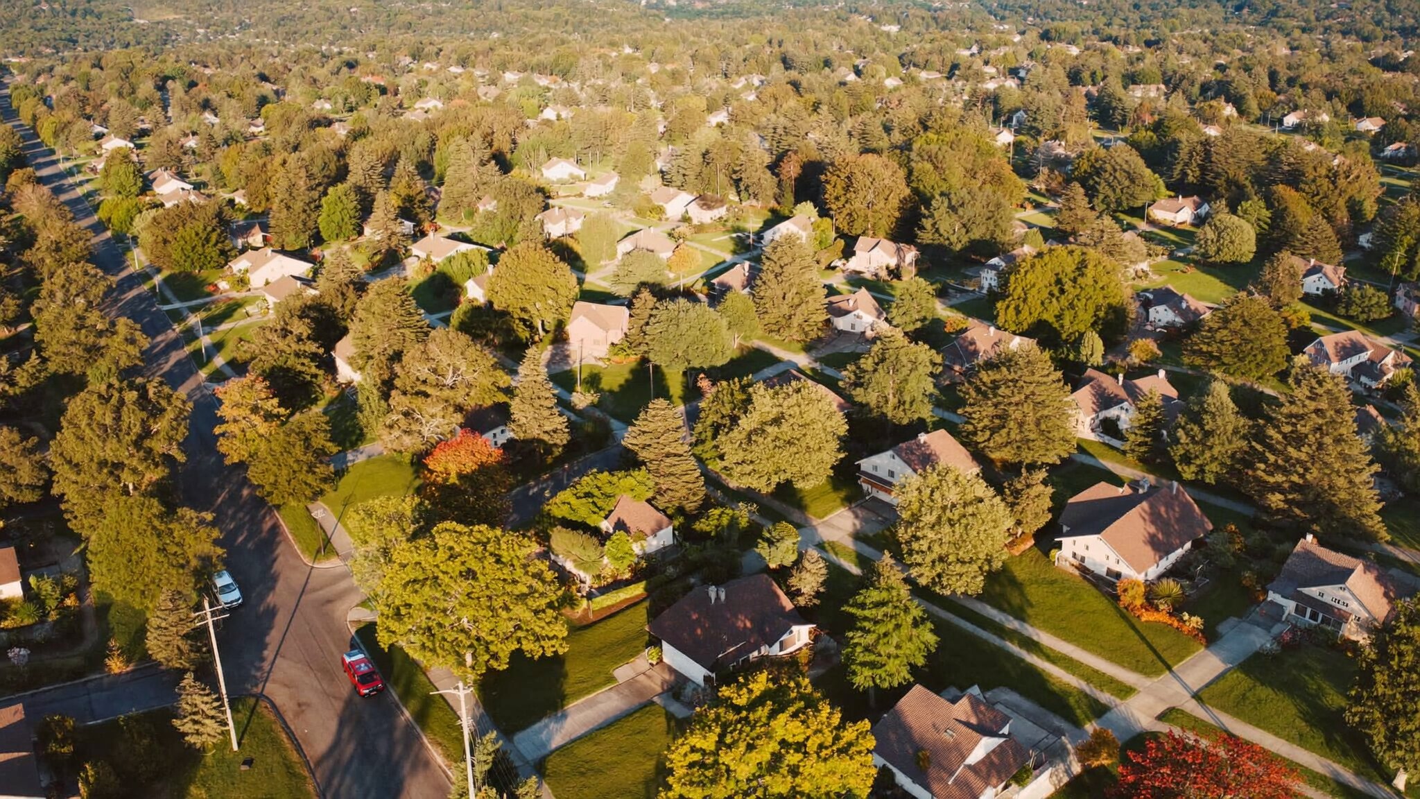 Aerial view of South King County neighborhood with Deep Plum overlay for King County real estate market update May 2026