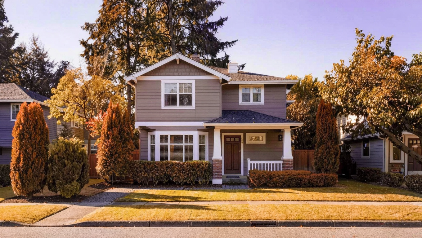 1970s to 1990s two-story single-family home exterior in Benson Hill Renton Washington with mature landscaping and composite siding.