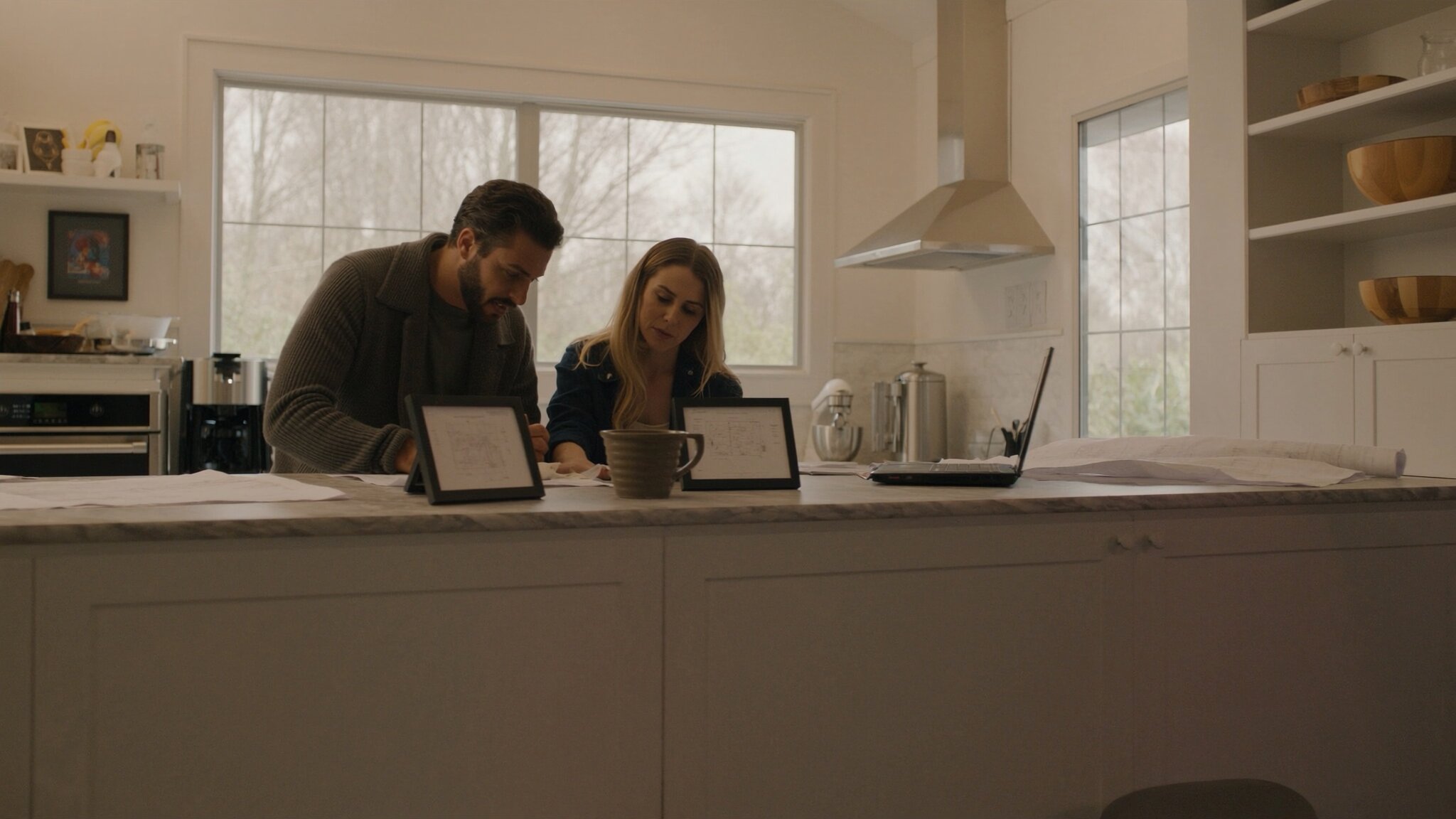 Couple reviewing renovation plans in an updated kitchen, a common use of home equity in King County WA