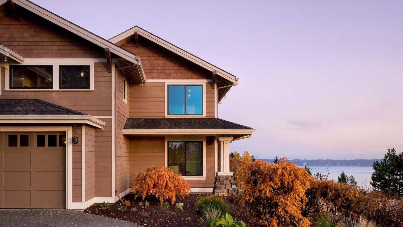 Quality late 1990s to 2000s Pacific Northwest home exterior on East Lake Sammamish Parkway in Sammamish Washington with mature landscaping and hillside siting that implies lake views