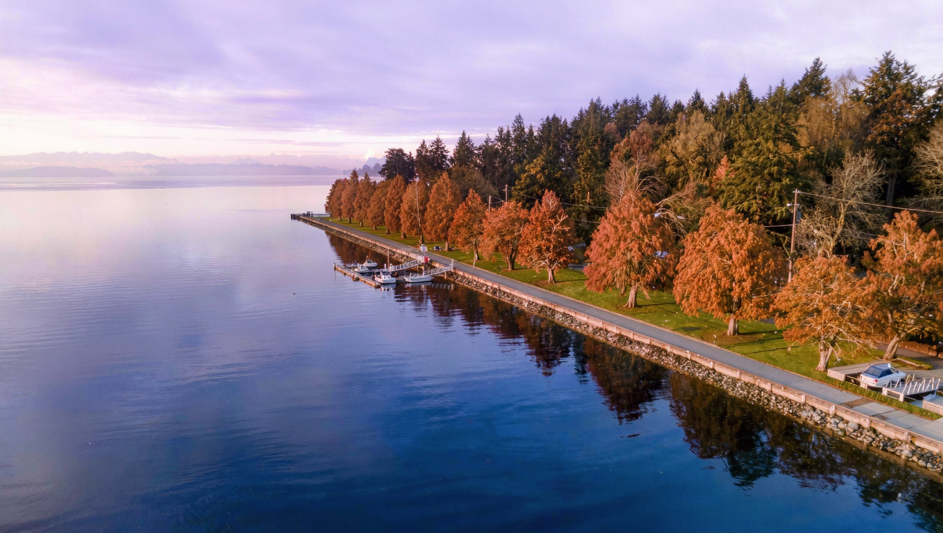 Gene Coulon Memorial Beach Park shoreline along Lake Washington in Renton WA with paved waterfront path and dock