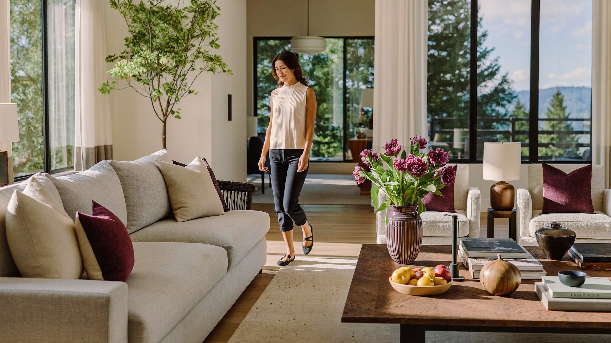 Homeowner walking through a well-staged King County home in warm summer light