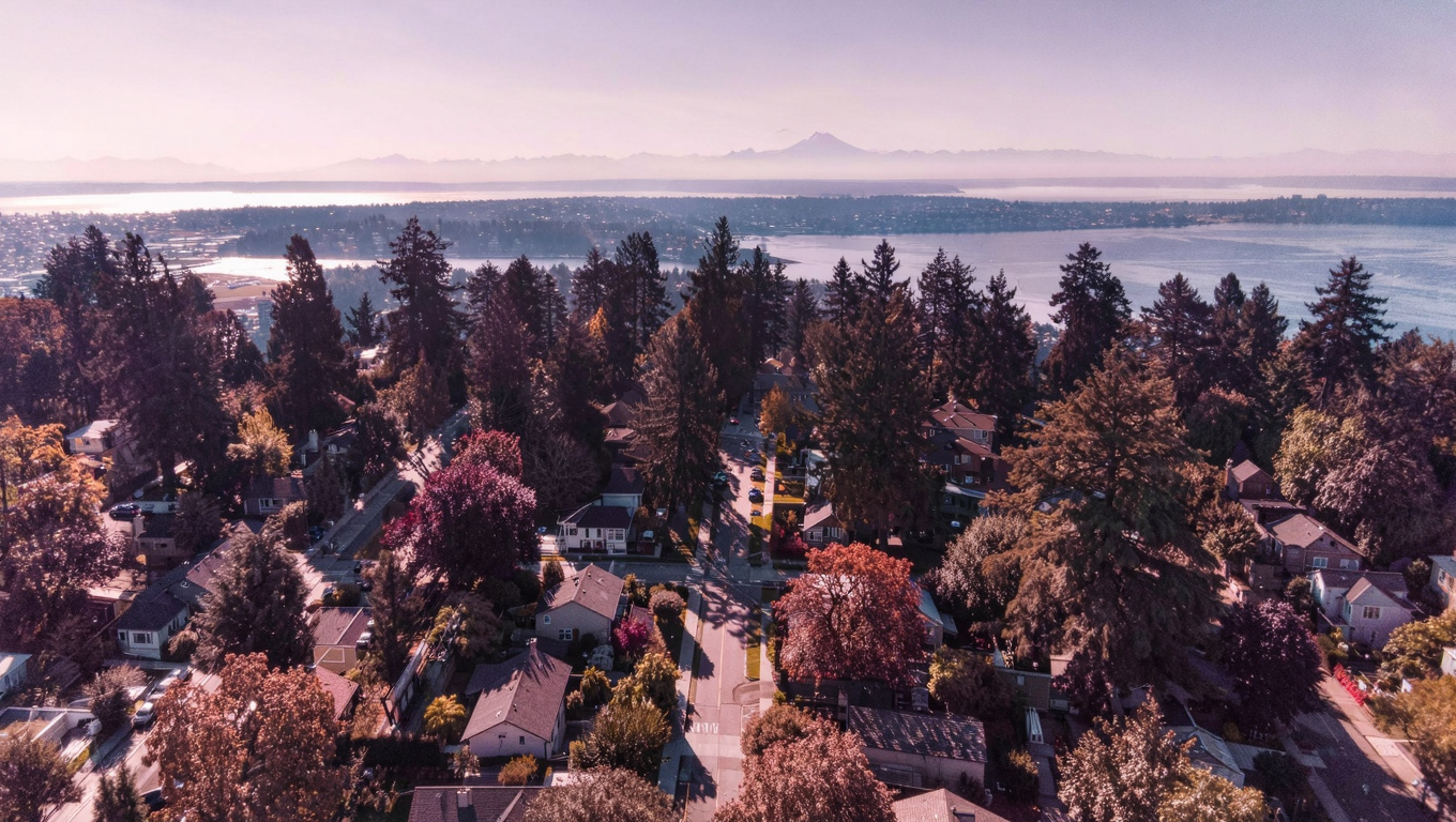 Aerial view of Kennydale neighborhood in Renton, King County, Washington, with hillside residential streets and Lake Washington in the distance.
