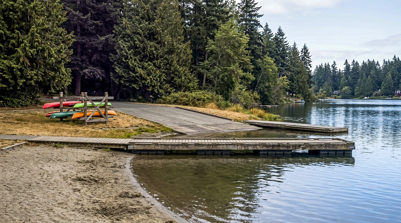 Families at the swim beach and boat launch at Lake Meridian Park in Kent, Washington