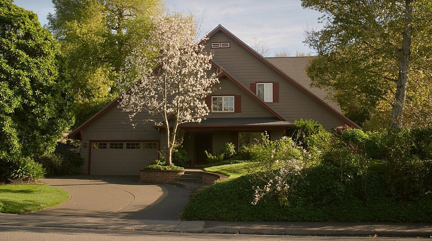 Auburn Washington real estate market 2026 -- suburban home with green lawn representing home values and investment opportunity in King County