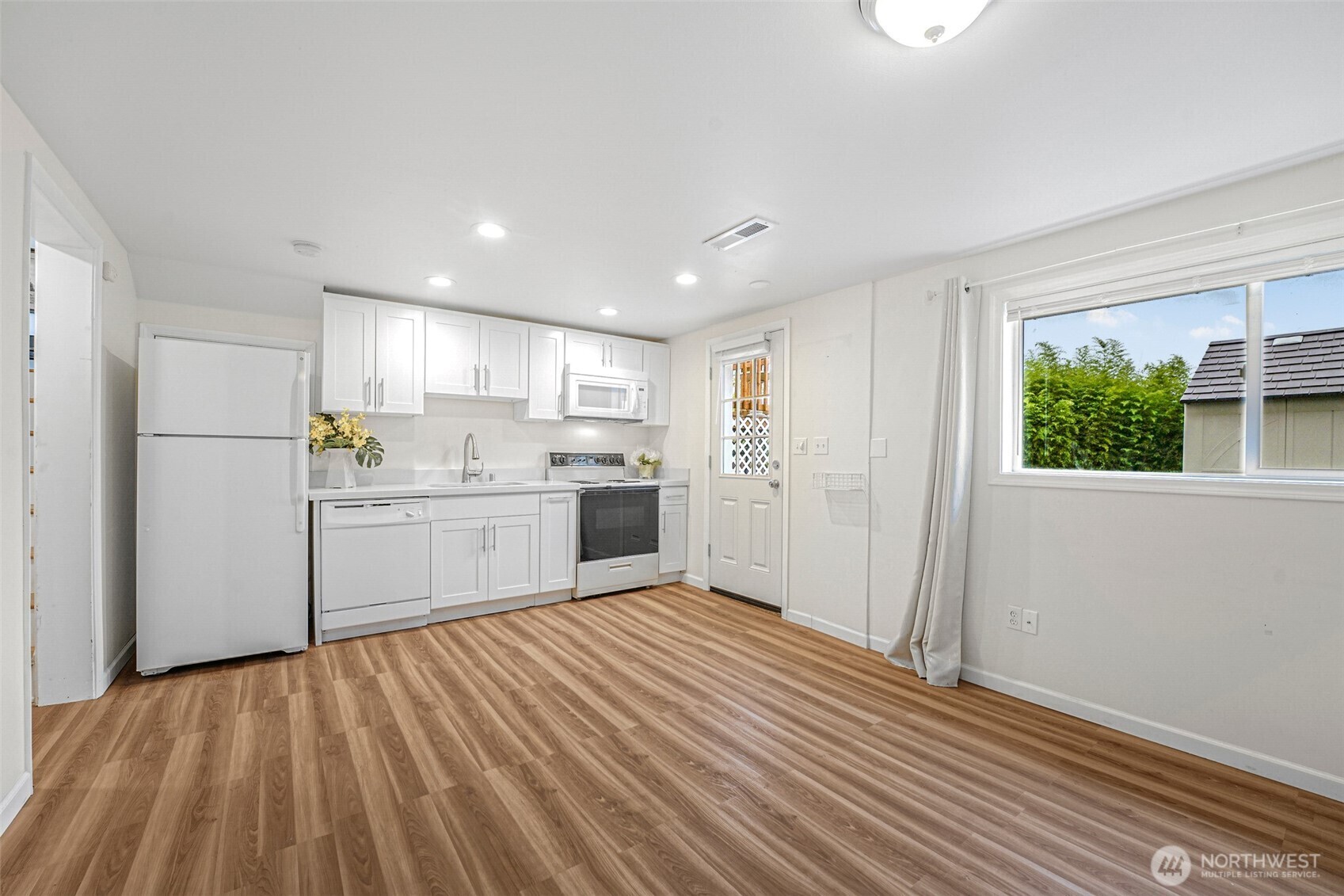 Lower-level space with sink, range and refrigerator