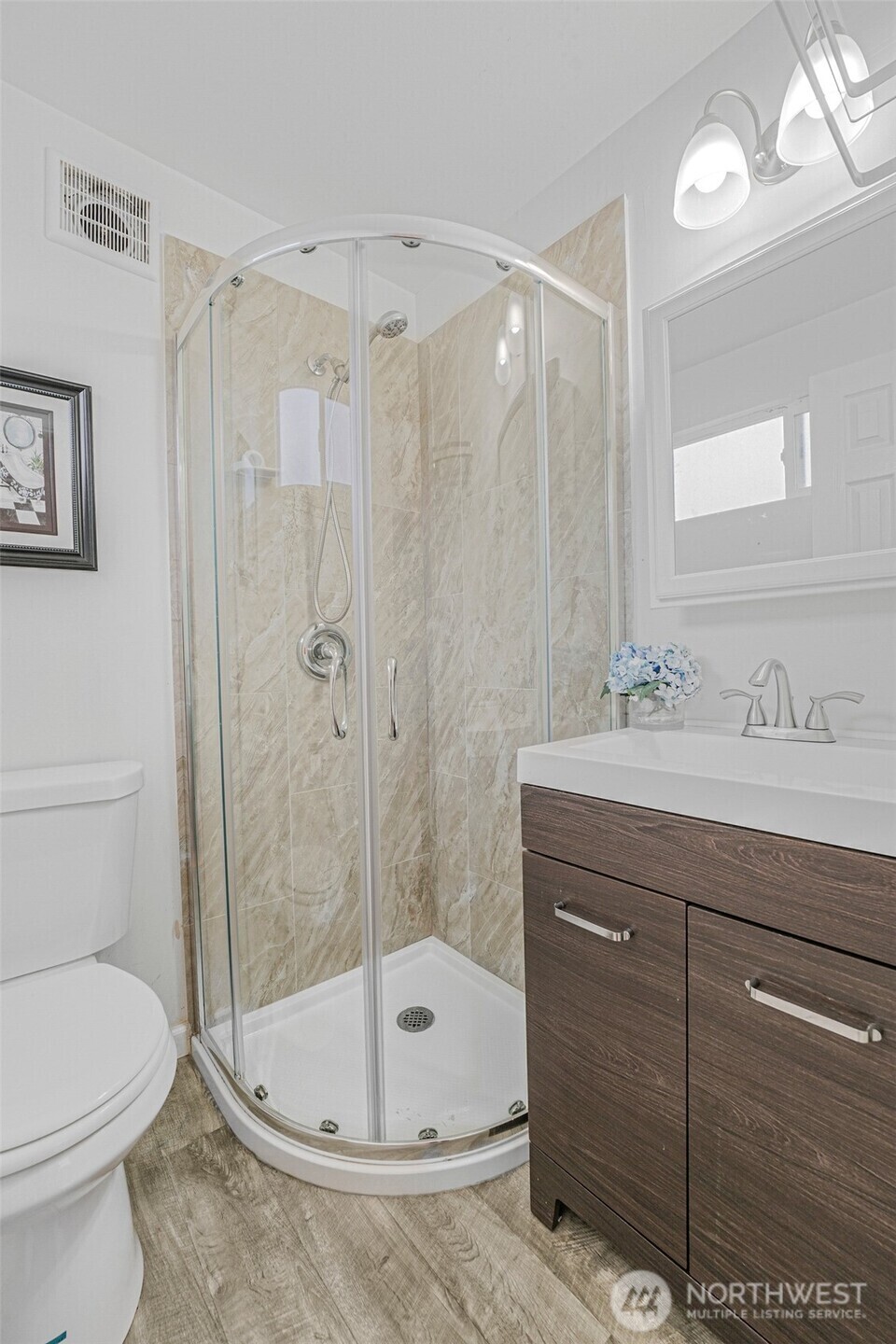 Bathroom with glass corner shower