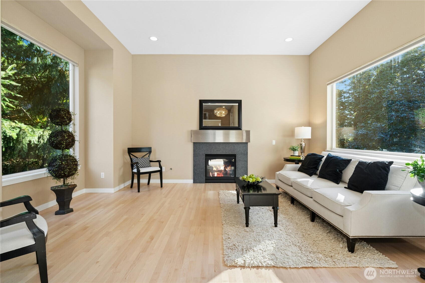 Living room with gas fireplace and a large picture window