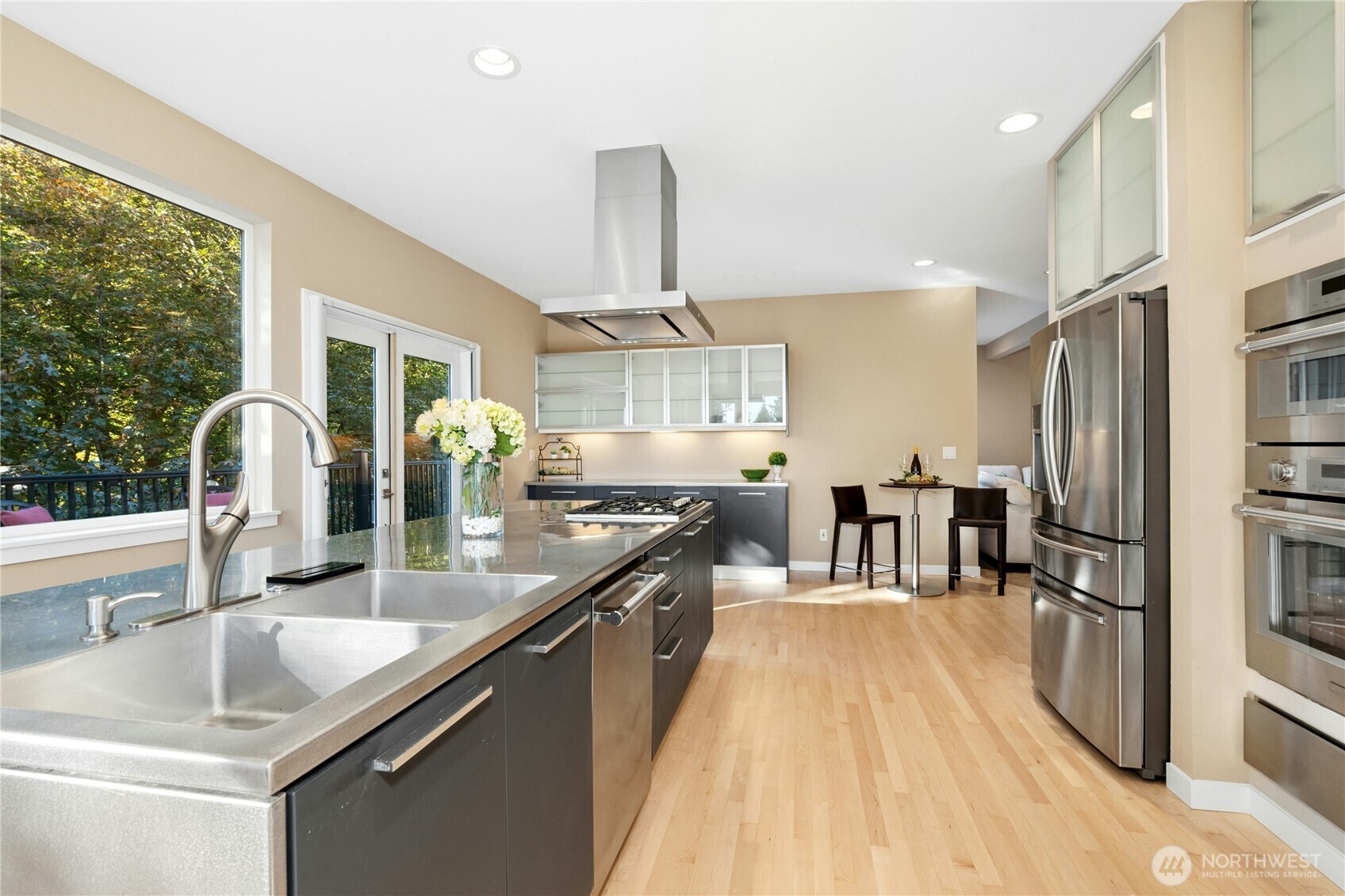 Kitchen with Italian stainless cabinets, black granite counters and stainless appliances