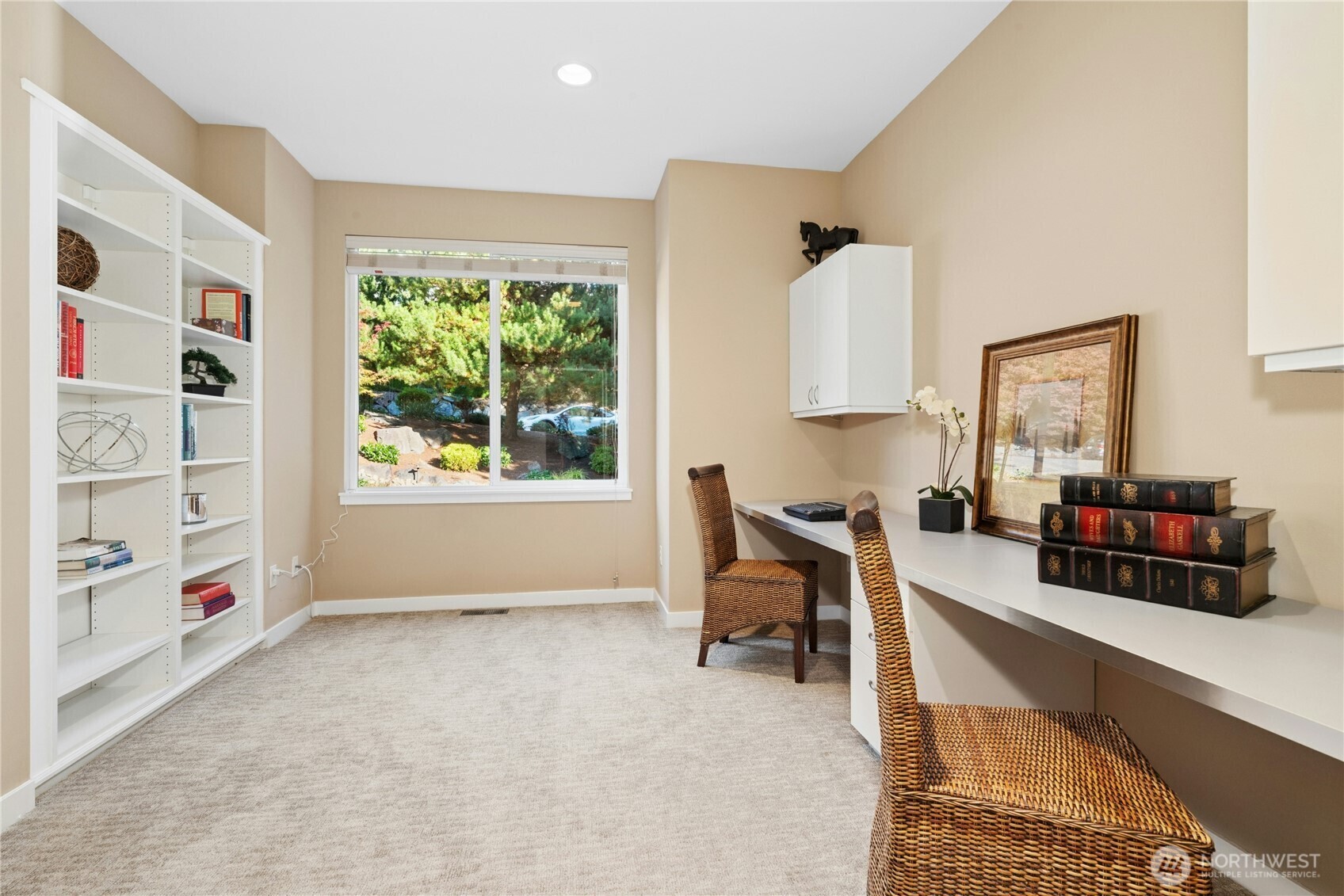 Main-floor office with built-in desks and bookcases