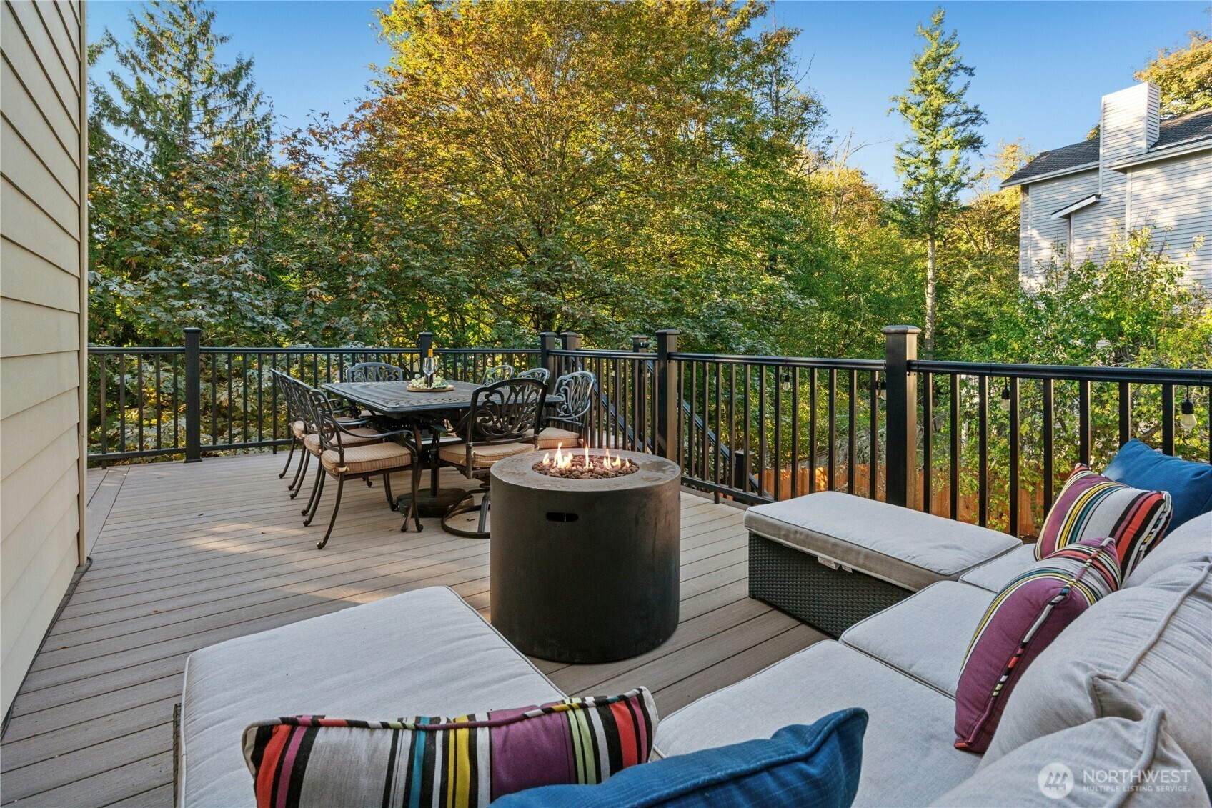 Composite deck with seating area and steel railings