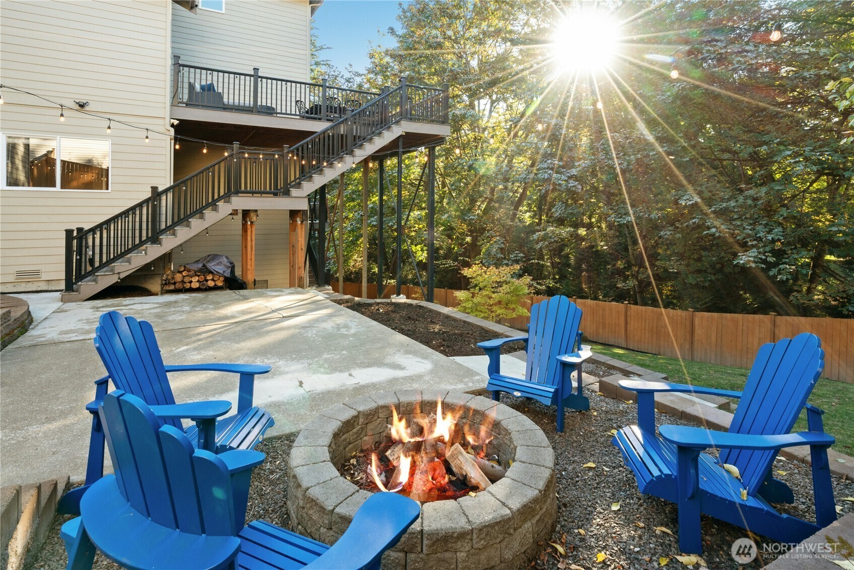 Patio with fire pit below the deck